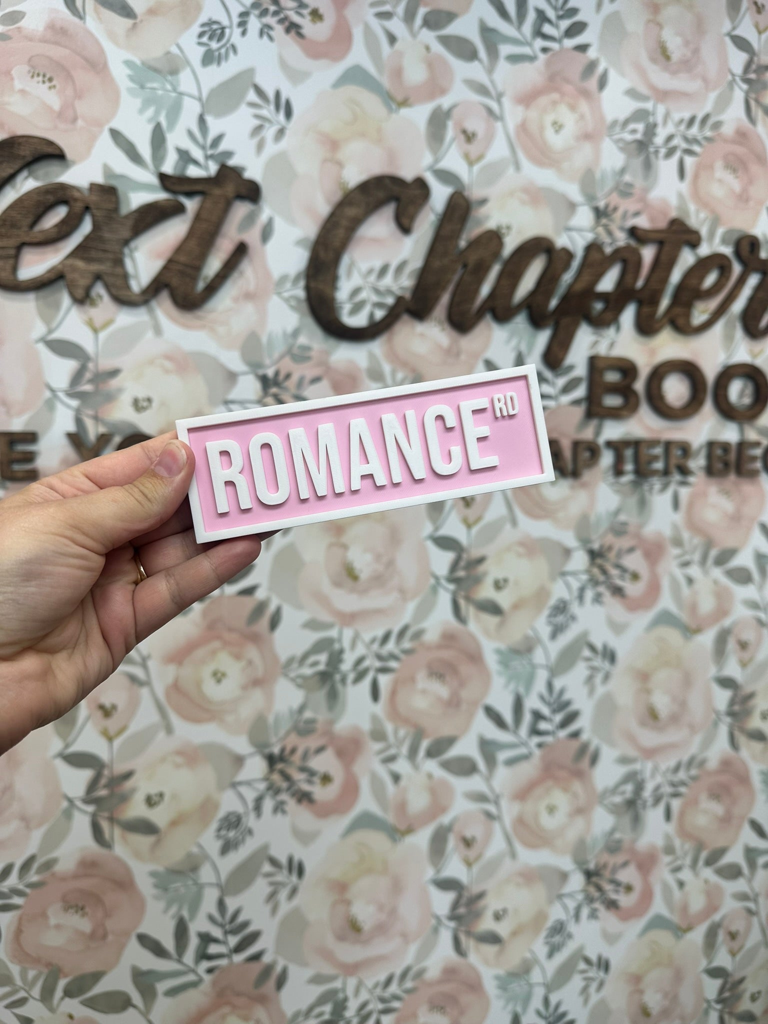 Romance Rd Shelf Sign